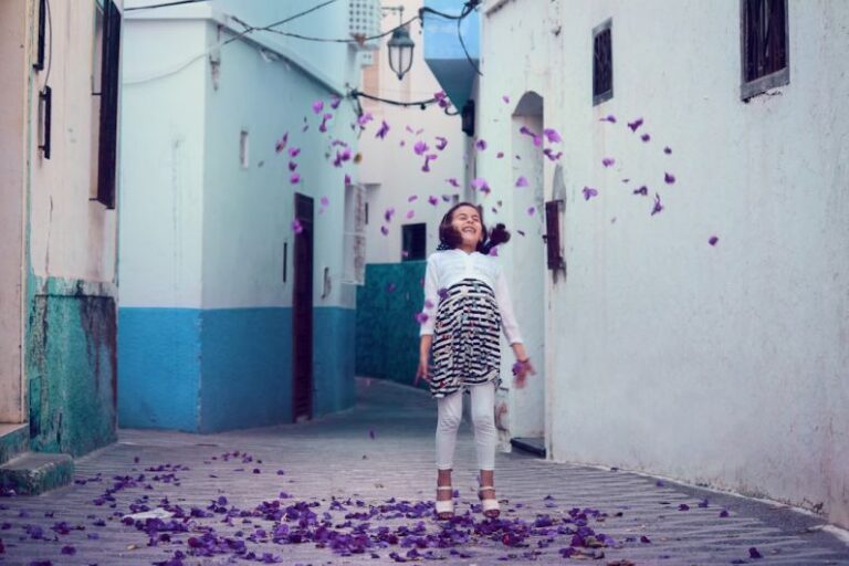 Urban Child - falling petals under girl