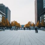 Urban - people walking on sidewalk near high rise buildings during daytime