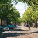 Urban Traffic - a street with cars parked on both sides of it