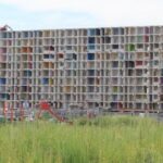 Urban Renewal - a tall building with lots of windows in it