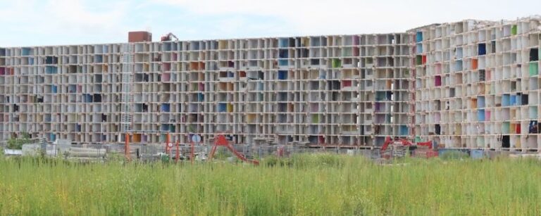 Urban Renewal - a tall building with lots of windows in it