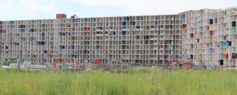 Urban Renewal - a tall building with lots of windows in it