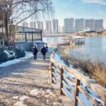 Park City - A walkway near a lake with snow on the ground