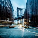 Smart Road - Manhattan Bridge between buildings wallpaper