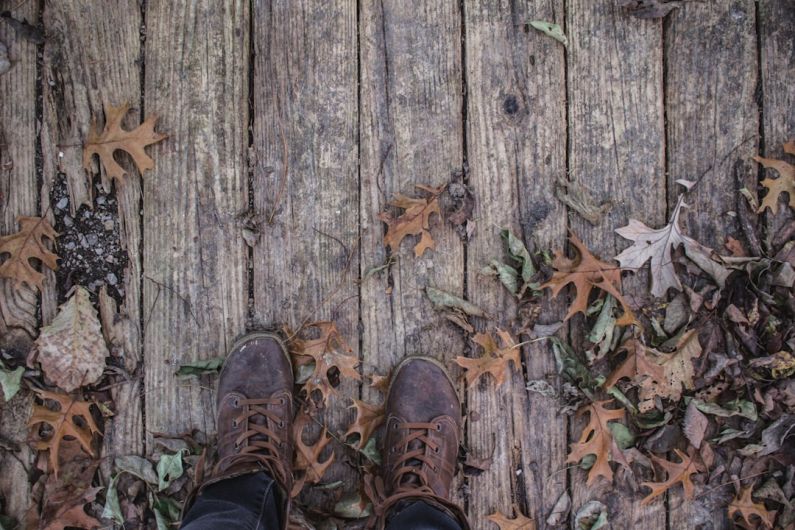 Composite Decking - person wearing pair of brown leather shoes