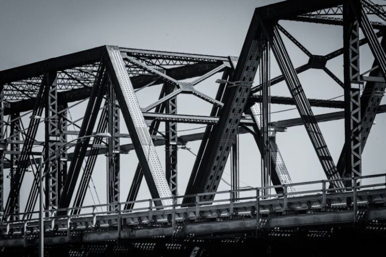 Bridge Construction - gray metal bridge under blue sky during daytime