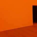 Design Theories - orange room with open door