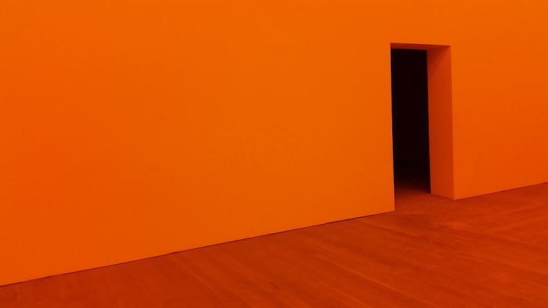 Design Theories - orange room with open door