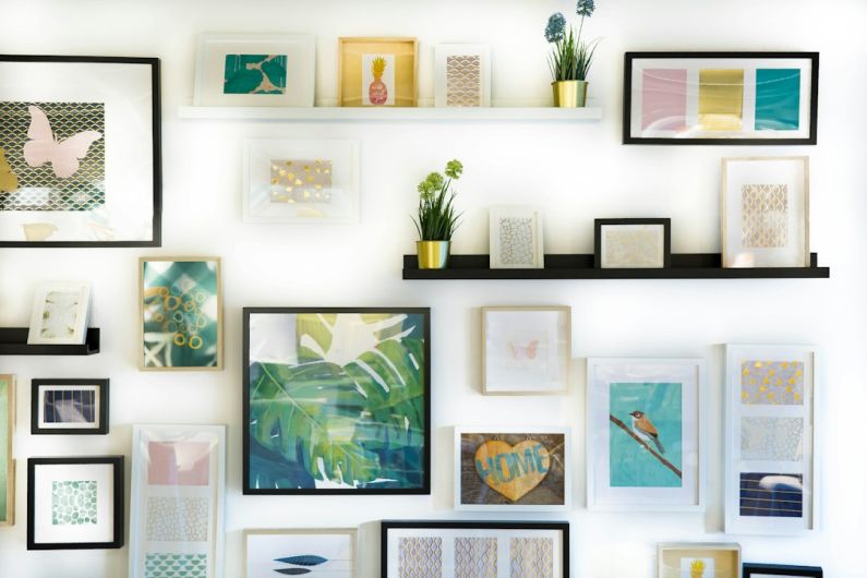 Decorating Home - assorted-color framed paintings on the wall