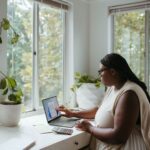 Home Office - a woman sitting at a table with a laptop