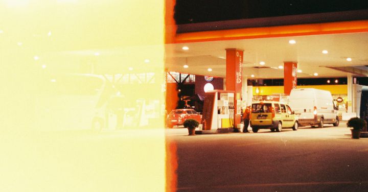 Autonomous Vehicles - Film Photograph of Cars at a Gas Station