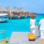 Tourism - Man and Woman Walks on Dock