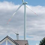 Tidal Power - Wind Turbines in the Sunflower Field