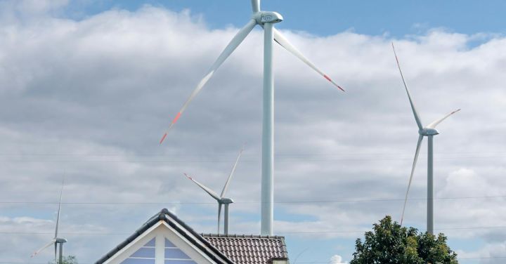 Tidal Power - Wind Turbines in the Sunflower Field